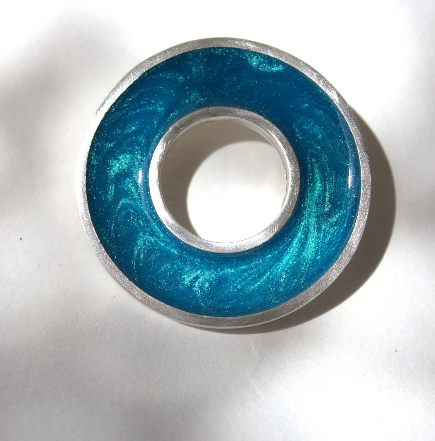 Central circle brooch