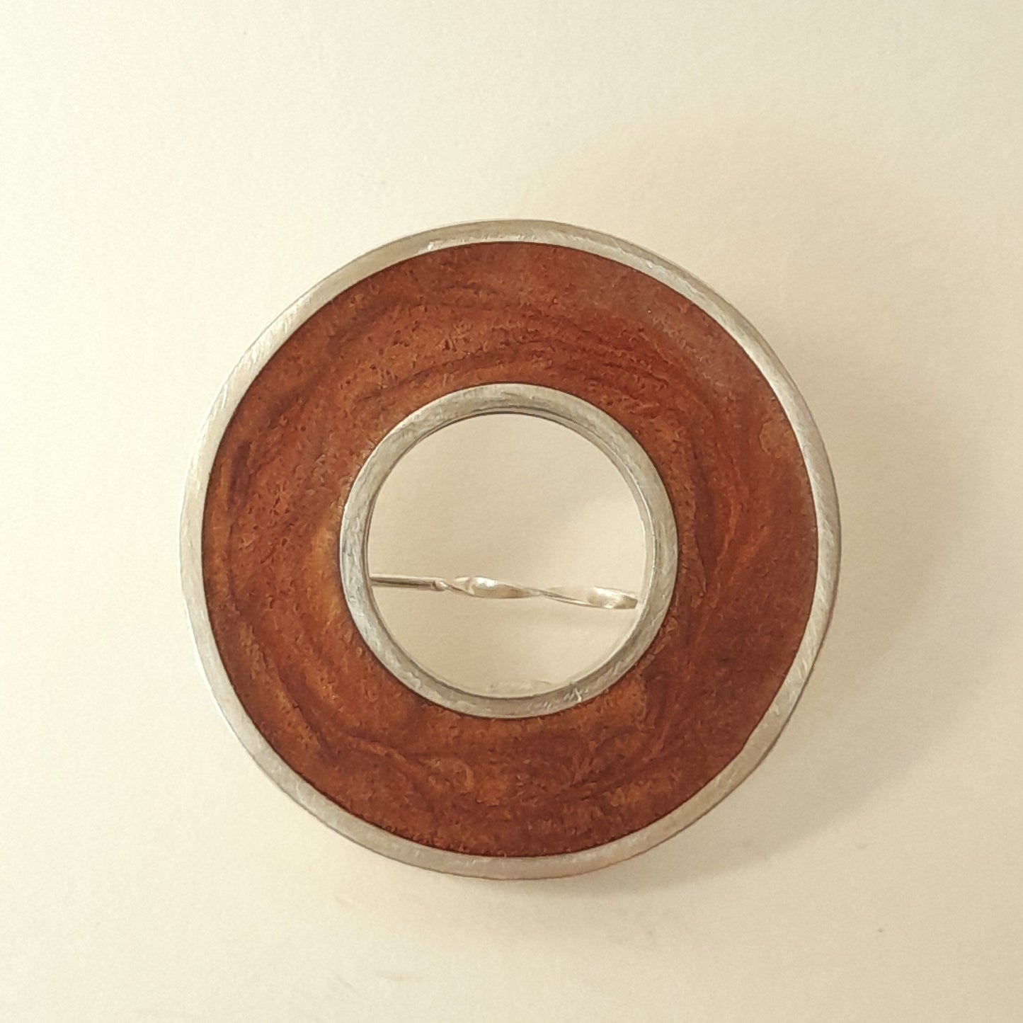 Central circle brooch